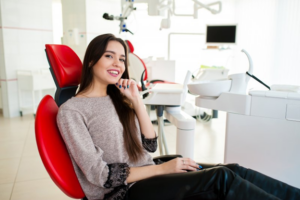 Woman smiling in the patient’s chair