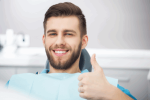 a patient smiling during a dental visit