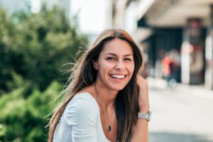 Woman smiling and showing teeth.