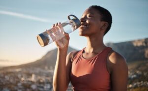 Woman drinking water.